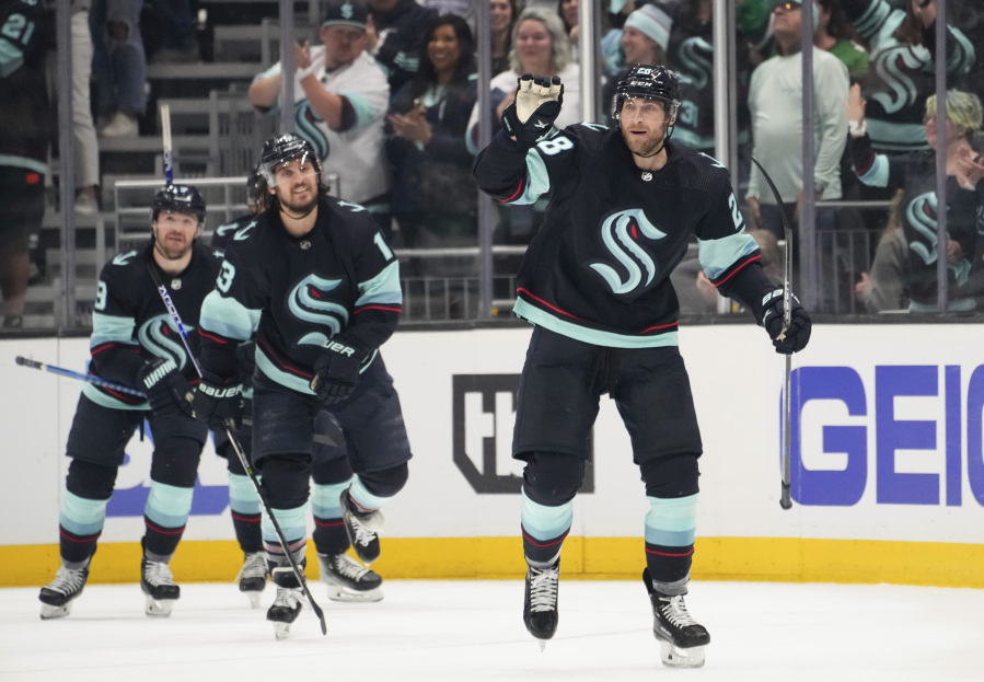 Seattle Kraken defenseman Carson Soucy (28) reacts after scoring against the Dallas Stars during the second period of Game 3 of an NHL hockey Stanley Cup second-round playoff series Sunday, May 7, 2023, in Seattle.