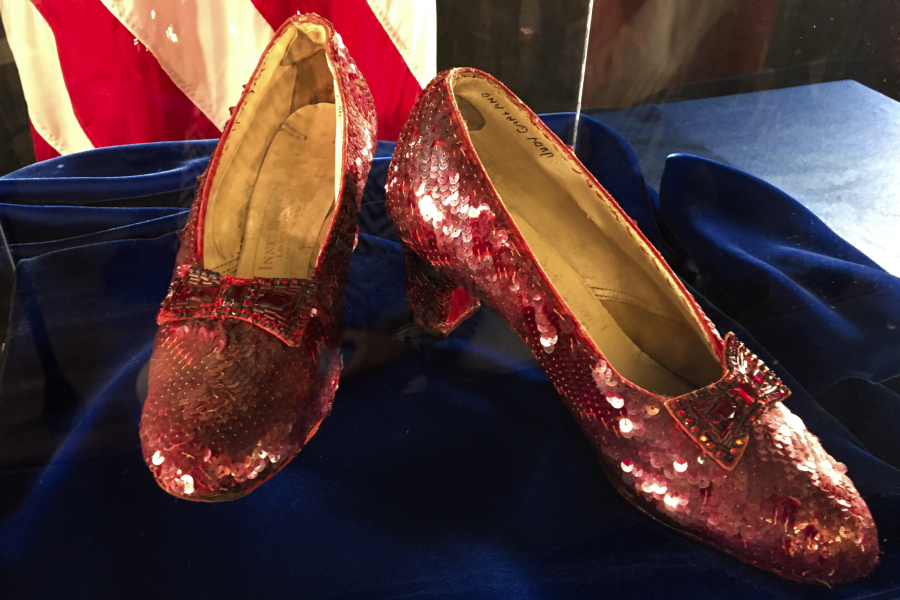 FILE - A pair of ruby slippers once worn by actress Judy Garland in the "The Wizard of Oz" sit on display at a news conference on Sept. 4, 2018, at the FBI office in Brooklyn Center, Minn. Federal prosecutors say a man has been indicted by a grand jury on Tuesday, May 16, 2023, on charges of stealing a pair of ruby red slippers worn by Judy Garland in "The Wizard of Oz."  The FBI recovered the slippers in 2018.
