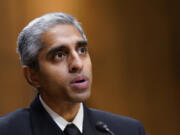 FILE - Surgeon General Dr. Vivek Murthy testifies before the Senate Finance Committee on Capitol Hill in Washington, on Feb. 8, 2022, on youth mental health care. Widespread loneliness in the U.S. is posing health risks as deadly as smoking a dozen cigarettes daily, costing the health industry billions of dollars annually, the U.S. surgeon general said Tuesday in declaring the latest public health epidemic. About half of U.S. adults say they've experienced loneliness, Murthy said in a new, 81-page report from his office.
