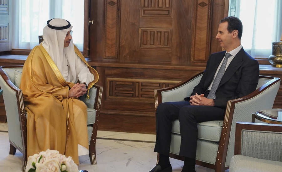 In this photo released by the official Facebook page of the Syrian Presidency, Syrian President Bashar Assad, right, meets with Saudi Arabia ambassador to Jordan Nayef al-Sadiri, in Damascus, Syria, Wednesday, May 11, 2023. Assad Wednesday received an invitation from Saudi Arabia to attend the upcoming Arab League summit at the oil-rich kingdom, the Syrian president's office said in a statement. the invitation days after the Arab League restored Syria's membership into the organization in Cairo, Egypt, on Sunday, after it was suspended in 2011 for the country's brutal crackdown on pro-democracy protesters.