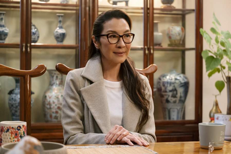 This image released by Disney+ shows Michelle Yeoh in a scene from "American Born Chinese." (Carlos Lopez-Calleja/Disney+ via AP)