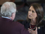 Sen. Angela Paxton, R-McKinney, talks to Sen. Paul Bettencourt, R-Houston, on the Senate Floor at the Capitol in Austin, Texas, on Thursday May 25, 2023. About two hours later, the House General Investigating Committee recommended articles of impeachment against her husband, Attorney General Ken Paxton.