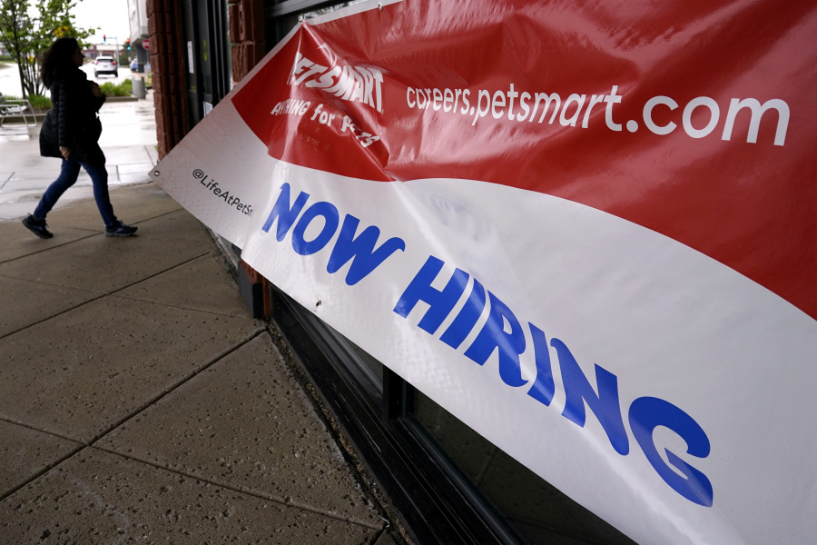 A hiring sign is displayed at a retail store in Downers Grove, Ill., Monday, May 1, 2023. On Thursday, the Labor Department reports on the number of people who applied for unemployment benefits last week. (AP Photo/Nam Y.