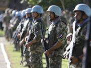 FILE - Soldiers line up at the United Nations Peace Operations Training Center (CECOPAZ) before the arrival of United Nations Secretary-General Ban Ki-Moon in Asuncion, Paraguay, on Feb. 26, 2015. The organization is marking the 75th anniversary of U.N. peacekeeping and observing the International Day of United Nations Peacekeepers on Thursday, May 25, 2023.
