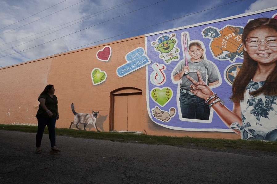 Veronica Mata visits a mural honoring her daughter, Tess, in Uvalde, Texas, Wednesday, May 3, 2023. For Mata, teaching kindergarten in Uvalde after her daughter was among the 19 students who were fatally shot at Robb Elementary School became a year of grieving for her own child while trying to keep 20 others safe.