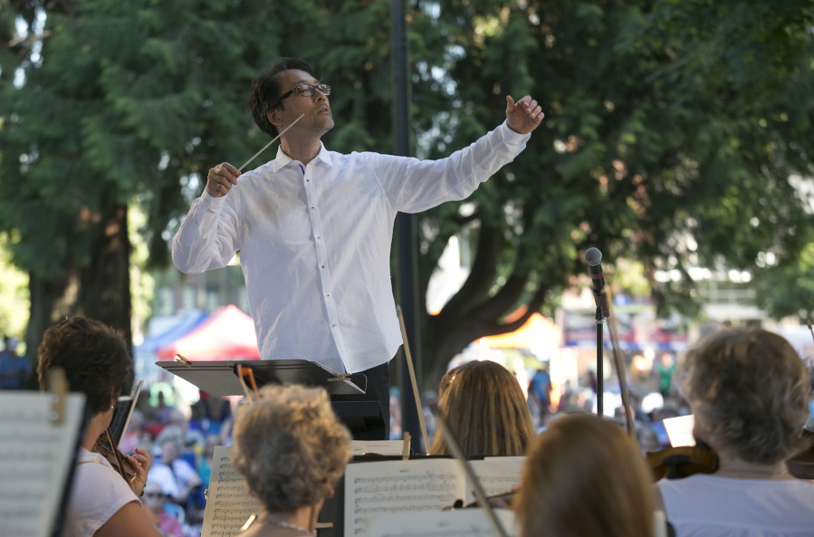 Ken Selden conducts the Vancouver Symphony Orchestra as it performs a concert of light classical music in Esther Short Park in 2018. The orchestra and the city of Vancouver are collaborating on the inaugural Vancouver USA Arts and Music Festival Aug. 4-6 in and around Esther Short Park.