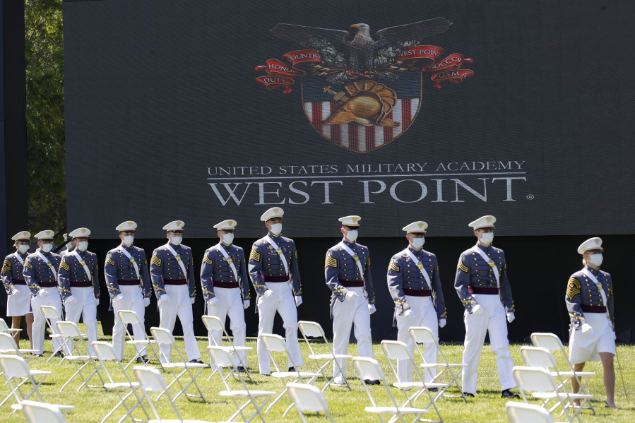 FILE - United States Military Academy graduating cadets, wearing face masks, march to their socially-distanced seating during commencement ceremonies on June 13, 2020, in West Point, N.Y. Vice President Kamala Harris will be the first woman to deliver a commencement speech at a West Point graduation ceremony, White House officials said. Harris will deliver the keynote address on May 27 at the U.S. Military Academy for the Class of 2023.