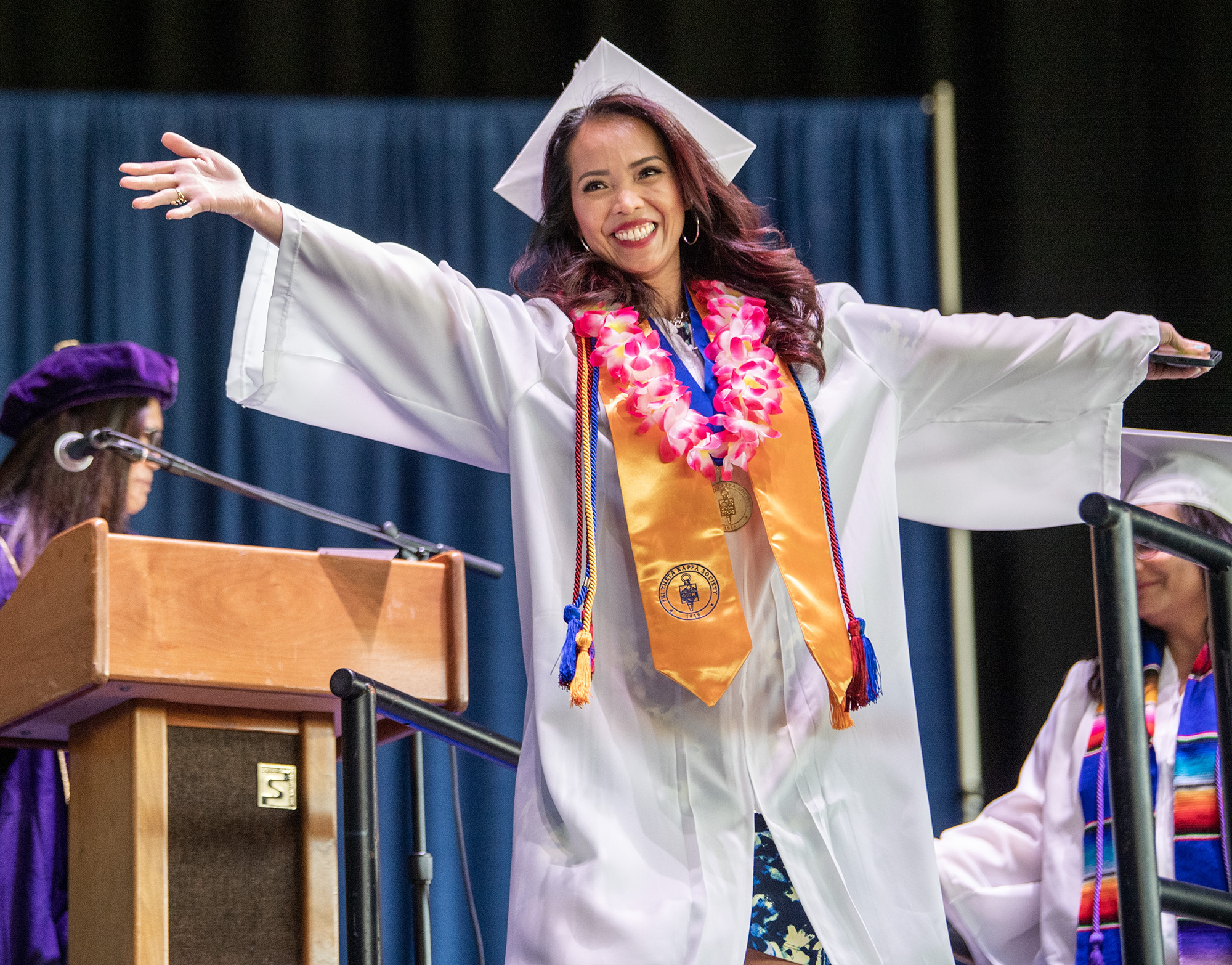 A Clark College graduate celebrates receiving their diploma Thursday, June 15, 2023, at the Clark College Commencement ceremony at RV Inn Style Resorts Amphitheater.