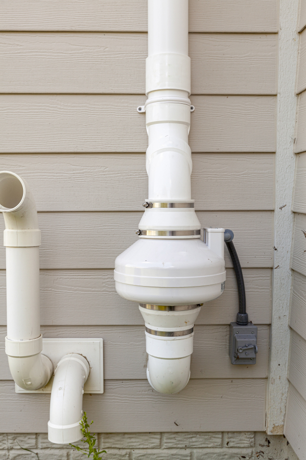 A radon mitigation system uses pipes and fans to redirect radon out of the home.