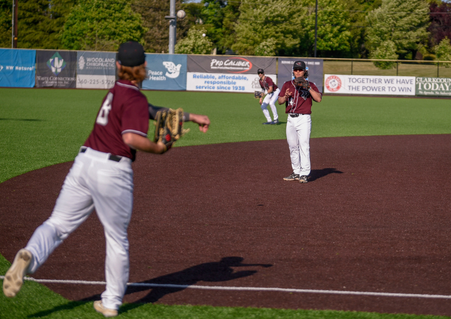 Second-year Ridgefield Raptors players Trent Prokes (8) and Jake Tsukada (14) play catch prior to the start of the Raptors' season-opening exhibition game against the Cowlitz Black Bears on Thursday, June 1, 2023, at Ridgefield Outdoor Recreation Complex.