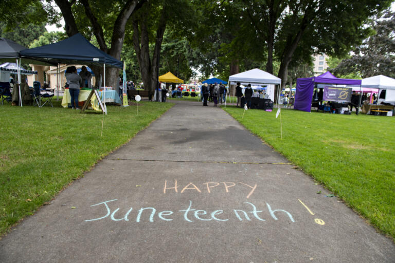 A message welcomes visitors to the Juneteenth Freedom Celebration at Esther Short Park on Friday afternoon, June 17, 2022. The event featured great food, live music, art, informational booths and traditional games.
