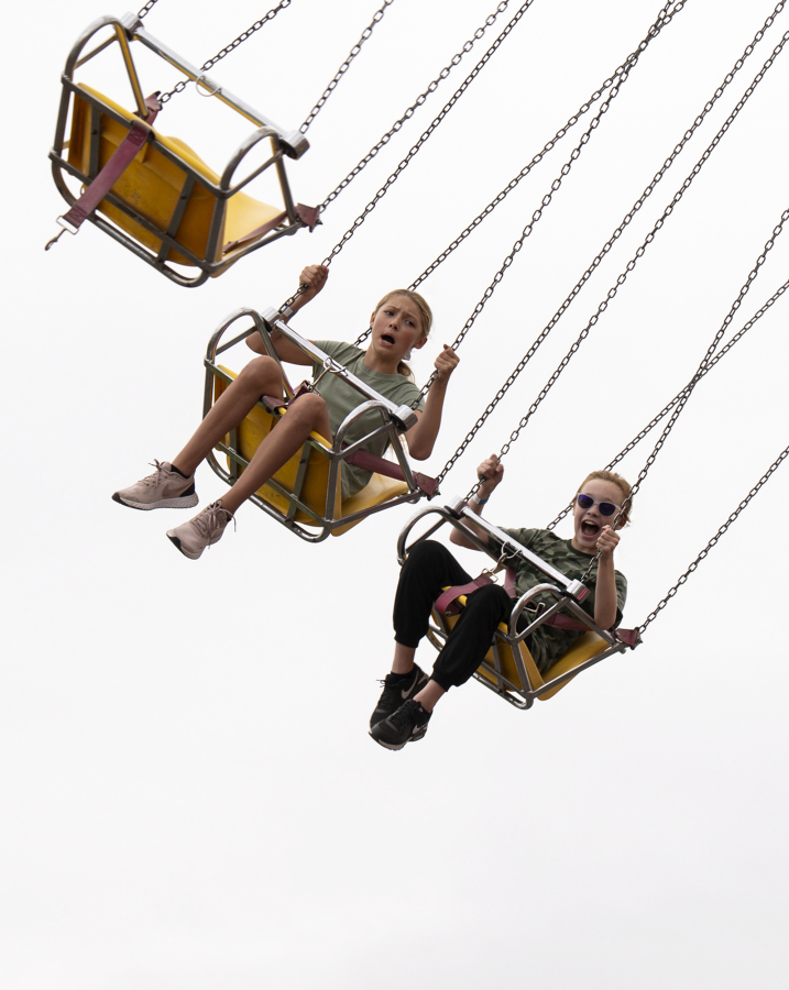 Two kids scream while riding "Yoyo" at the Clark County Fair.