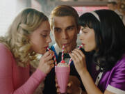 From left, Lili Reinhart as Betty Cooper, KJ Apa as Archie Andrews and Camila Mendes as Veronica Lodge in The CW's "Riverdale." The show features overhead clips of Harbor Springs, Michigan, to represent the fictional town.