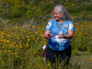 Jana Johnson is all smiles as she watches one of her "babies" fly into the wild during a blue butterfly release on March 18, 2023, on Los Angeles' Palos Verdes Peninsula.