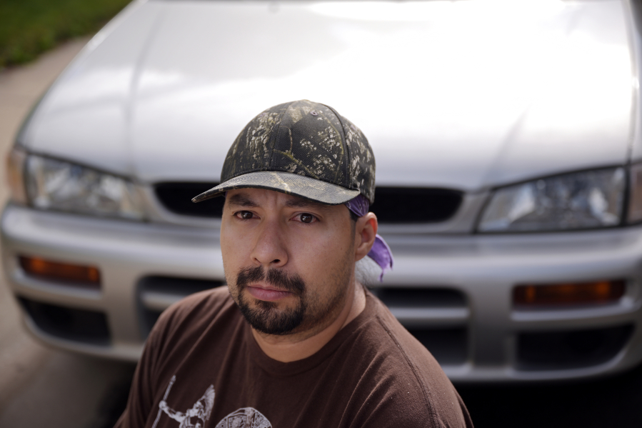 Roman Gutierrez poses for a portrait with his 1999 Subaru Impreza in front of his home in Westminster on Friday, May 26, 2023.