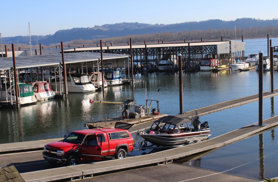 A man lowers his boat into the Columbia River at Parker's Landing Marina. Port of Camas-Washougal leaders hope a deal with the world's largest membership-only boat club will make Camas-Washougal marina more accessible.