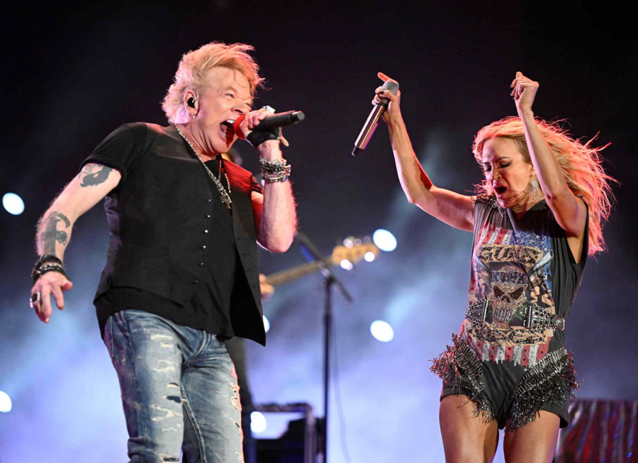 Guns N' Roses lead singer Axl Rose makes a surprise appearance April 30 with Carrie Underwood to sing a pair of the group's famous songs during the second day of the Stagecoach Country Music Festival in Indio, Calif.