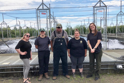 Rian Sallee, at right, the new director of Washington's southwest region, poses with employees of the Goldendale Hatchery during a recent tour. Sallee originally comes from the Midwest, and brings with her a strong conservation background.