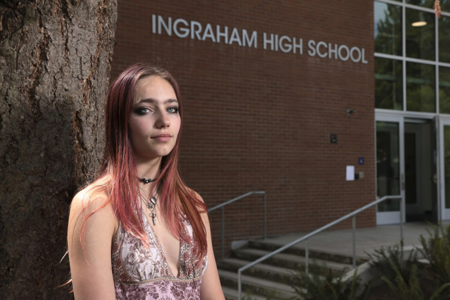 Seattle Student Union Executive Board member Noir Goldberg, 17, a junior at Ballard High School, is pictured outside Ingraham High School, where a student was shot and killed last fall, following a press conference announcing the launch of Reach Out Seattle.