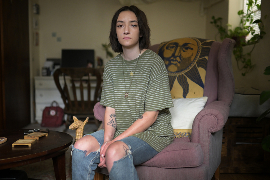Lizzy Earhart sits in her apartment in Denver on Tuesday, May 30, 2023. Earhart says being treated for anorexia at an Eating Recovery Center facility left her with additional trauma.