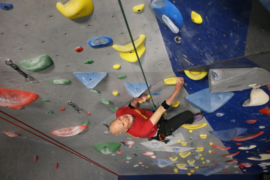 John Mowat, 94, climbs a route at the Bend Rock Gym in Bend, Ore.