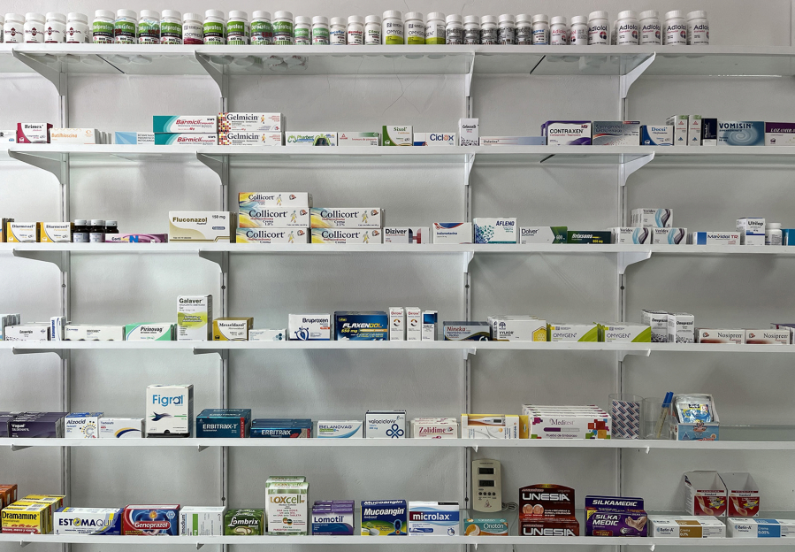 Medications are lined up on wide shelves in a pharmacy in Puerto Vallarta, Mexico on May 5, 2023. Counterfeit pills, Los Angeles Times reporters found, are often kept in containers under the counter or in a back room.