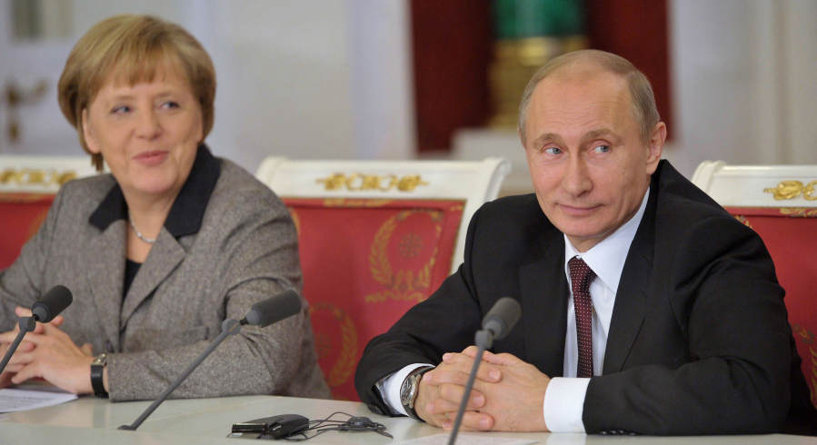 Russian President Vladimir Putin (right) and German Chancellor Angela Merkel meet in the Kremlin in  Moscow, on Nov. 16, 2012.