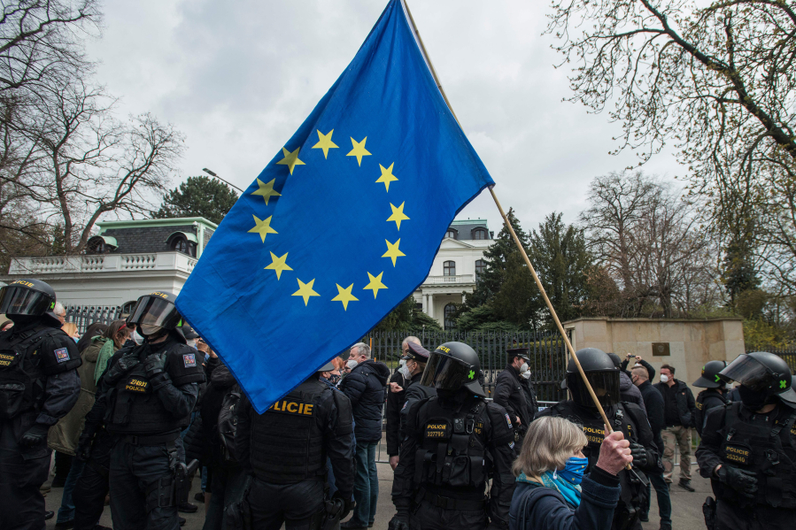 A protester holds a European Union flag during a rally in front of the Russian Embassy on April 18, 2021 in Prague, Czech Republic.