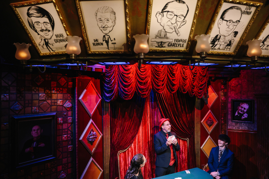 The magician Sharpo performs at the Magic Castle with Trichia Sulham, left, and Matt Sulham, right, on Tuesday, May 30, 2023, in Los Angeles.