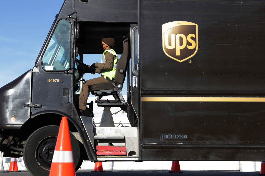 In this file photo, a United Parcel Service (UPS) driver leaves a UPS facility that is delivering vaccines to the Washington, D.C., and Maryland areas March 15, 2021, in Landover, Maryland.