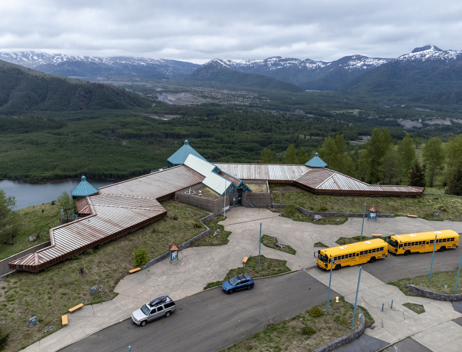 School buses sit parked in front of the Mount St. Helens National Volcanic Monument Science and Learning Center at Coldwater on May 23. The facility is entering a new phase of life that is expected to boost its capacity to host thousands of students and boost tourism.