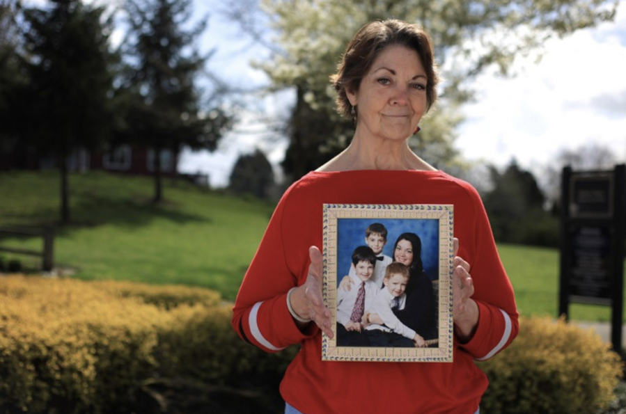 Vicki Bickford has always been a caregiver; soon she will need one of her own as her arthritis progresses. Bickford holds a photo of herself and her three children.