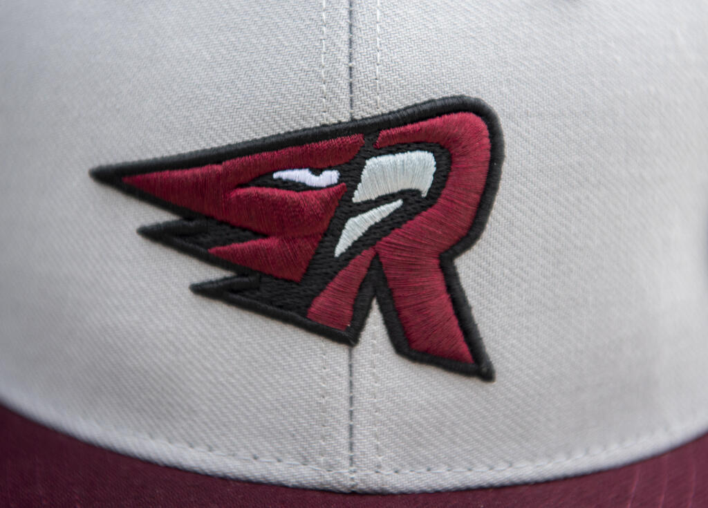 The Ridgefield Raptors logo sits on a hat Friday, June 16, 2023, during the Raptors' game against Cowlitz at the Ridgefield Outdoor Recreation Complex.