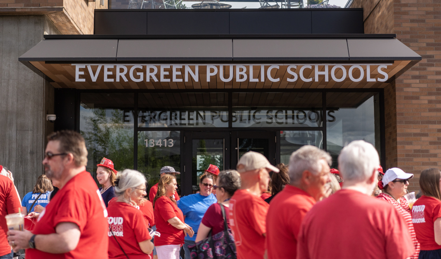 Evergreen Education Association members and allies stand outside the Evergreen Public Schools headquarters on June 14 in advance of a school board meeting. The union and the district are now entering mediation.