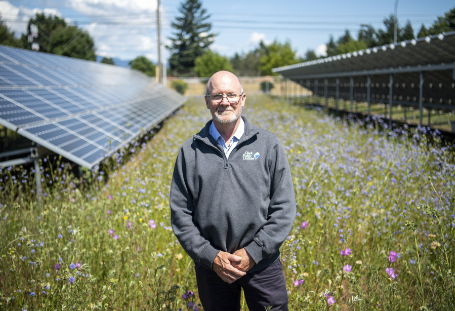 Michael O'Loughlin, Clark Public Utilities environmental sustainability manager, stands in the utility's Community Solar Pollinator Meadow at its Orchards operations center.