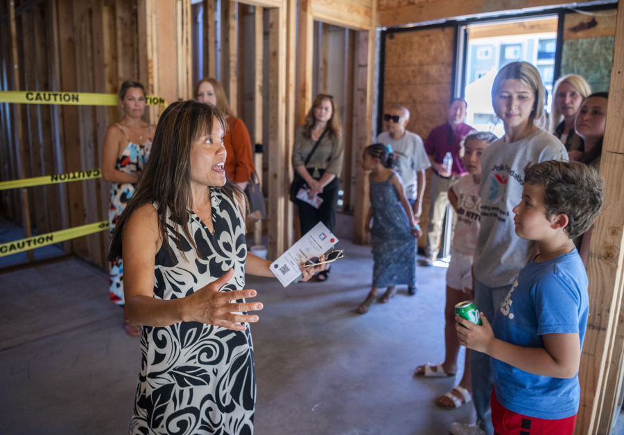 Architect Sharilyn Hidalgo, left, leads a tour through the Mullen-Polk Foundation's new facility, Our Next Generation II, on Thursday at the building's ground-breaking ceremony.