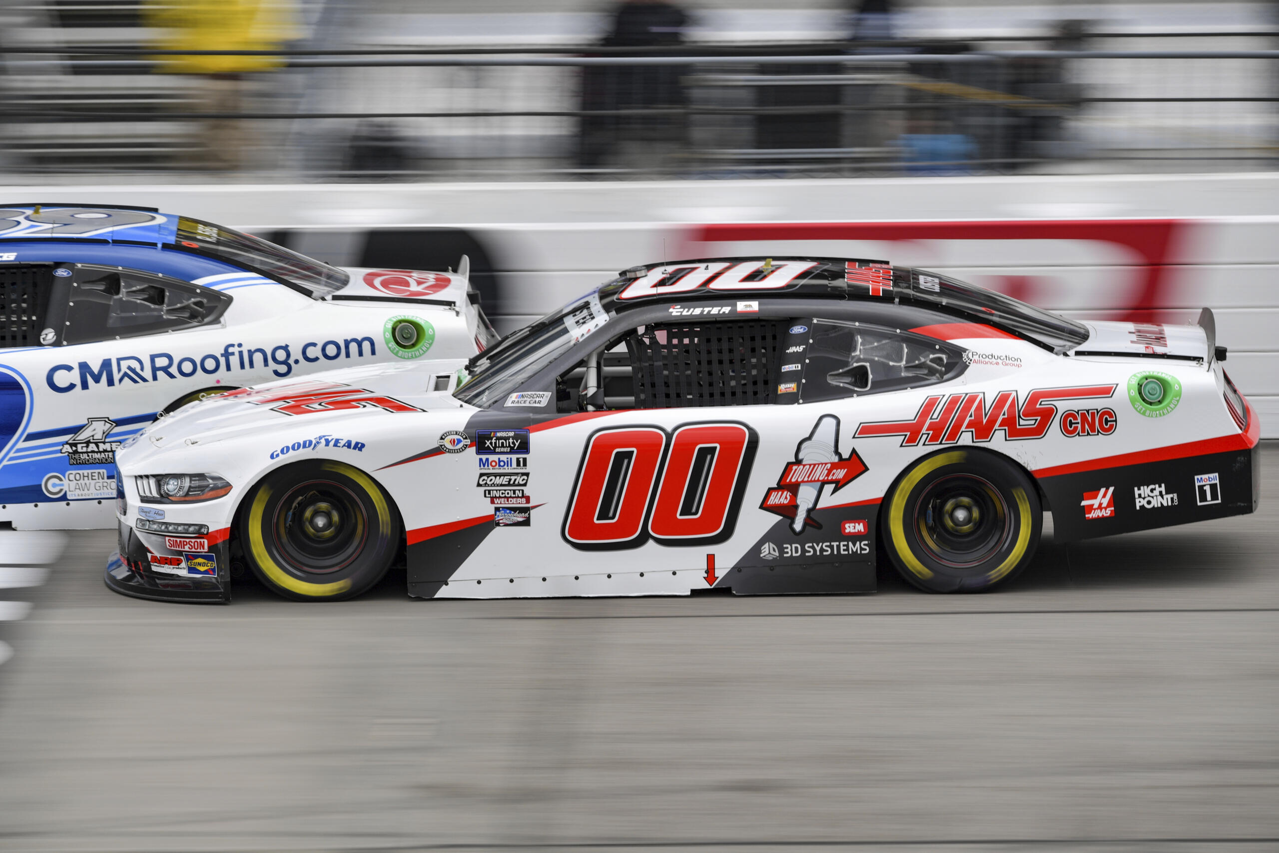 Cole Custer (00) attempts to pass Ryan Sieg (39) during a NASCAR Xfinity Series auto race at Richmond Raceway on Saturday, April 1, 2023, in Richmond, Virginia.