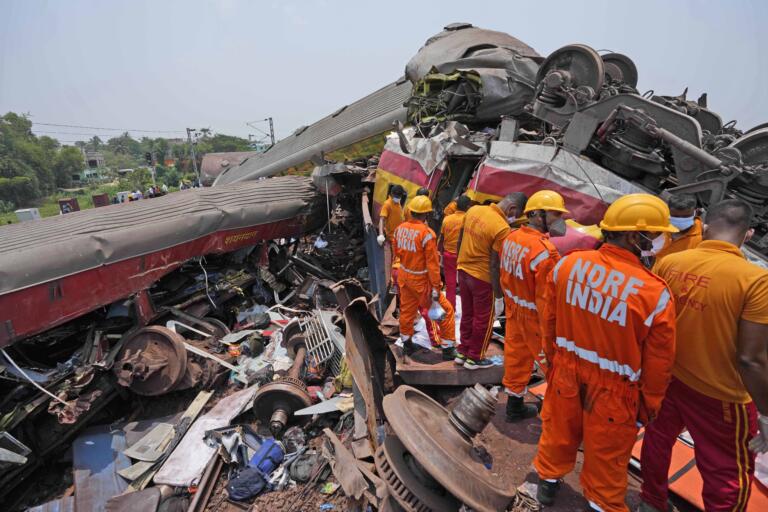 Rescuers work at the site of passenger trains that derailed in Balasore district, in the eastern Indian state of Orissa, Saturday, June 3, 2023. Rescuers are wading through piles of debris and wreckage to pull out bodies and free people after two passenger trains derailed in India, killing more than 280 people and injuring hundreds as rail cars were flipped over and mangled in one of the country’s deadliest train crashes in decades.