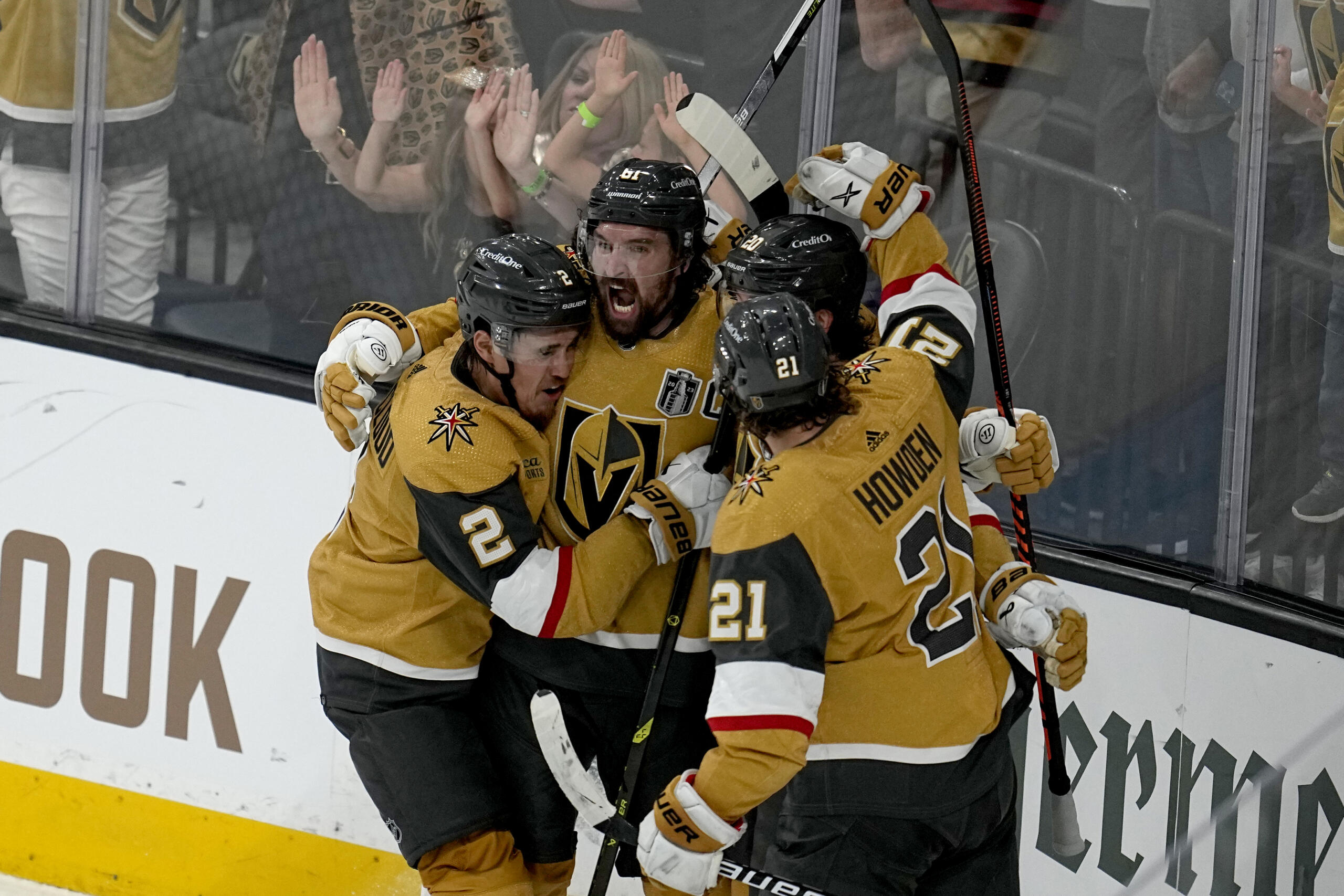 Vegas Golden Knights right wing Mark Stone, left, celebrates his goal against the Florida Panthers with Brett Howden (21), defenseman Zach Whitecloud (2) and center Chandler Stephenson during the third period of Game 1 of the NHL hockey Stanley Cup Finals, Saturday, June 3, 2023, in Las Vegas.