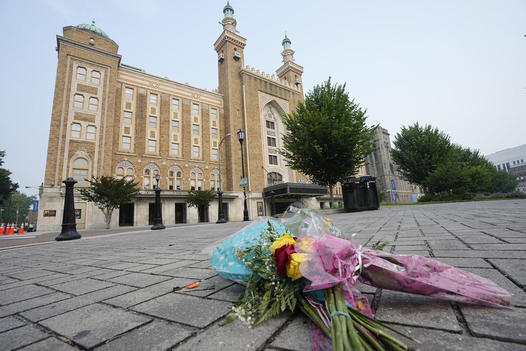 Flowers are placed in front of the Altria Theater which was the site of a mass shooting after a graduation ceremony Wednesday, June 7, 2023, in Richmond, Va.