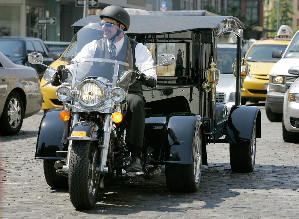 FILE - Peter Moloney, of Moloney Family Funeral Homes in Lake Ronkonkoma, N.Y., rides his Harley Davidson hearse from the Tombstone Hearse Co. of Alum Bank, Pa., in New York, May 24, 2007. Maloney was arrested Wednesday, June 7, 2023, on charges that he sprayed wasp killer at police officers and assaulted journalists — including an Associated Press photographer — during the Jan. 6, 2021, riot at the U.S. Capitol, authorities said.
