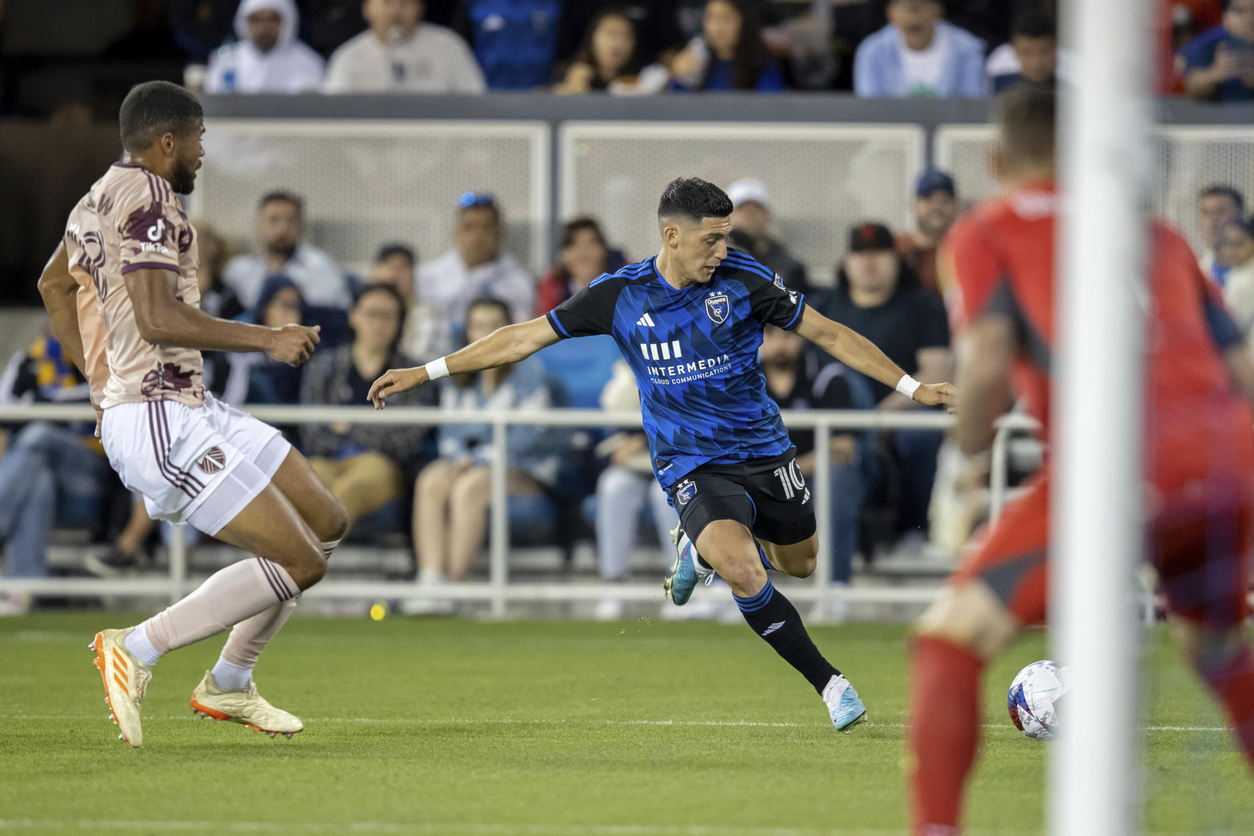 San Jose Earthquakes forward Cristian Espinoza, back right shoots next to Portland Timbers defender Zachery McGraw, left, during the second half of an MLS soccer match in San Jose, Calif., Saturday, June 17, 2023. The game ended in a scoreless draw.