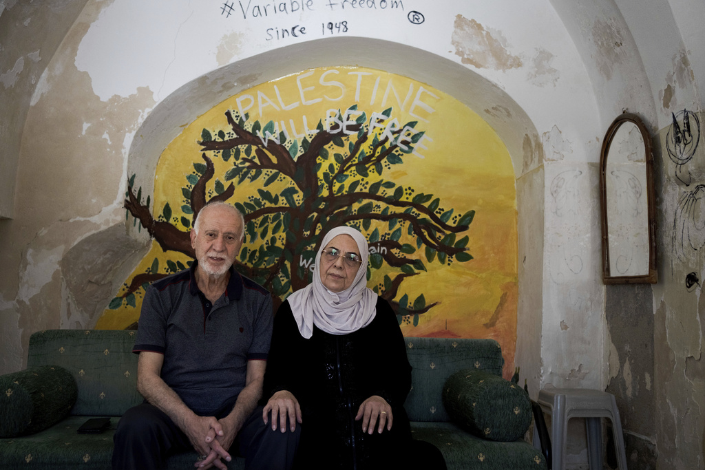 Nora and Mustafa Ghaith-Sub Laban pose for a portrait in their home in the Old City of Jerusalem Wednesday, June 21, 2023. The family has battled Israeli attempts to force them out for the past 45 years. The campaign ended this spring, when the Israeli Supreme Court struck down their final appeal in favor of Jewish settlers contending they violated the lease. Now, Israeli authorities have ordered the eviction of the family to take place by July 13.