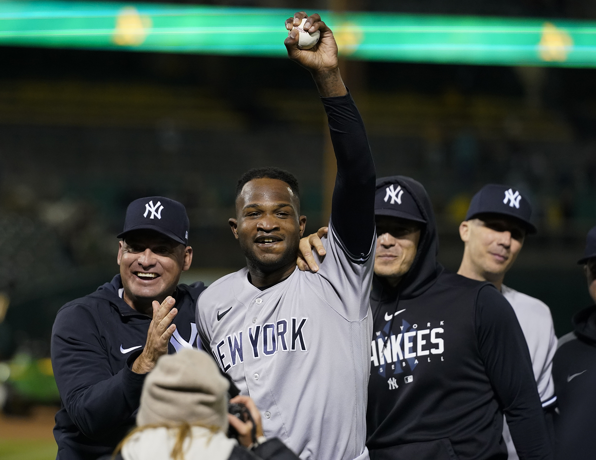 New York Yankees' Domingo Germán, center, celebrates after pitching a perfect game against the Oakland Athletics during a baseball game in Oakland, Calif., Wednesday, June 28, 2023. The Yankees won 11-0. (AP Photo/Godofredo A.
