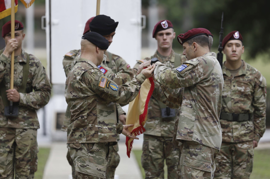 Lieutenant General Christopher T. Donahue, right, takes part of the Casing of the Colors during a ceremony to rename Fort Bragg on Friday, June 2, 2023 in Fort Bragg, N.C.  The U.S. Army changed Fort Bragg to Fort Liberty as part of a broader initiative to remove Confederate names from bases.