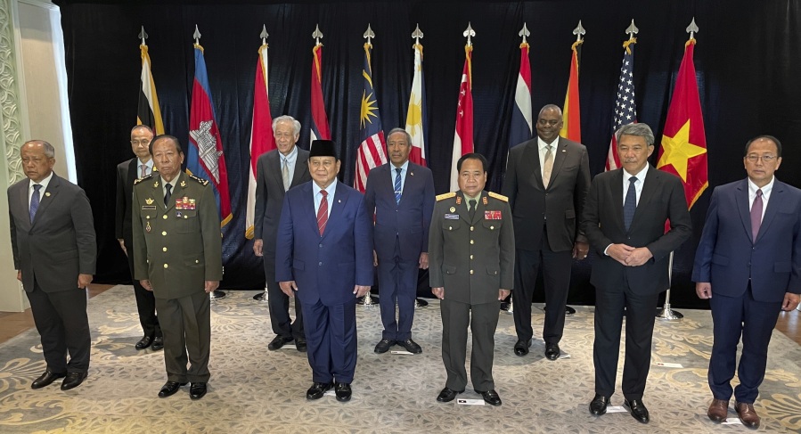In this photo released by MINDEF on Friday, June 2, 2023, from left to right front role, Brunei's Pehin Halbi, Cambodia's Tea Banh, Indonesia's Prabowo Subianto, Laos's Chanthong Soneta-ath, Malaysia's Mohamad Hasan, second role from left to right, Thailand's Sanitchanog Sangkachantra, Singapore's Ng Eng Hen, Timor Leste's Filomeno da Paix?o de Jesus, and U.S. Defense Secretary Lloyd Austin pose for group photo for US-SEA Defence Ministers' Informal Meeting during the 20th International Institute for Strategic Studies (IISS) Shangri-La Dialogue, Asia's annual defense and security forum, in Singapore, Friday, June 2, 2023.