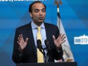 FILE - Consumer Financial Protection Bureau Director Rohit Chopra, speaks from the South Court Auditorium on the White House complex in Washington, April 11, 2022. The Consumer Financial Protection Bureau released a report Tuesday where the bureau lays out a number concerns about the growing use of chatbots by banks to handle routine customer service requests by customers.