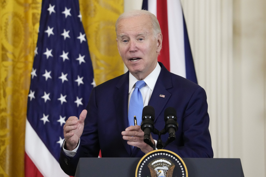 FILE - President Joe Biden speaks during a news conference with British Prime Minister Rishi Sunak in the East Room of the White House in Washington, June 8, 2023. Biden is set to sign an executive order that aims to bolster job opportunities for military and veteran spouses whose careers are often disrupted by their loved ones' deployments.