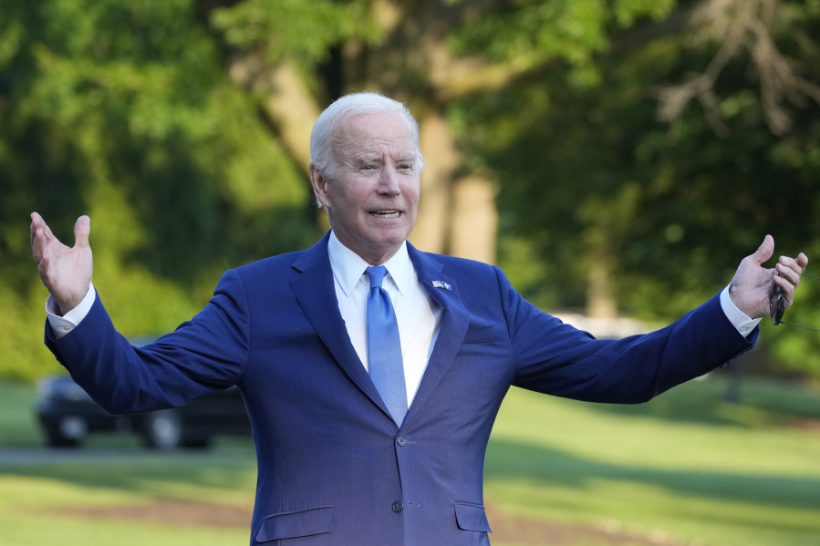 President Joe Biden says "I got sandbagged" in talking about falling earlier in the day at the U.S. Air Force Academy, as he walks from Marine One upon arrival on the South Lawn of the White House, Thursday, June 1, 2023, in Washington.