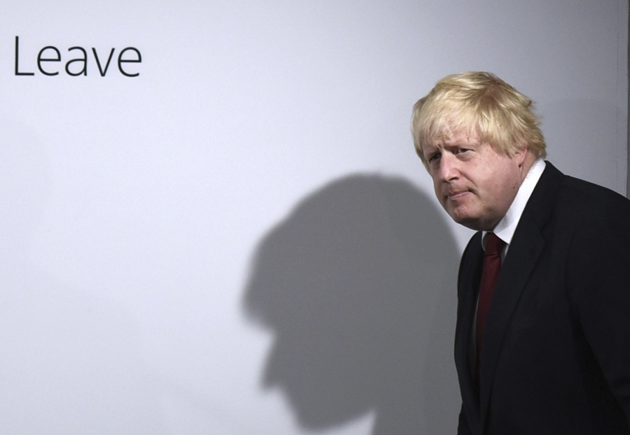 FILE - In this Friday, June 24, 2016 file photo, Vote Leave campaigner Boris Johnson arrives for a press conference at Vote Leave headquarters in London, He was the mayor who reveled in the glory of hosting the 2012 London Olympics, and the man who led the Conservatives to a whopping election victory on the back of his mission to "get Brexit done." But Boris Johnson's time as prime minister was marred by his handling of the coronavirus pandemic and a steady stream of ethics allegations.